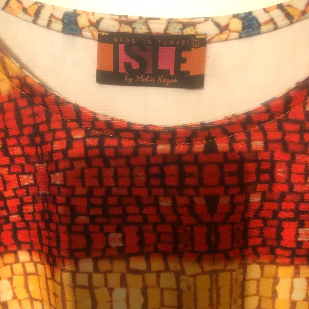 Never worn! Isle dress! Beautiful colors! Great stretch material!